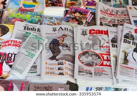 Hanoi, Vietnam - Sep 27, 2015: A newsstand with many daily newspapers on the sidewalk of a street in Hanoi capital. Vietnam has more than 600 state owned newspapers and media agencies.