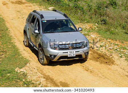 Hoabinh, Vietnam - Nov 17, 2015: Renault Duster 4x4 AT car running on the mountain road in Vietnam. Renault Duster is a compact SUV with great off-road capabilities.