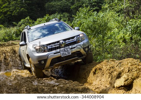 Hoabinh, Vietnam - Nov 17, 2015: Renault Duster 4x4 AT car running on the mountain road in Vietnam. Renault Duster is a compact SUV with great off-road capabilities.