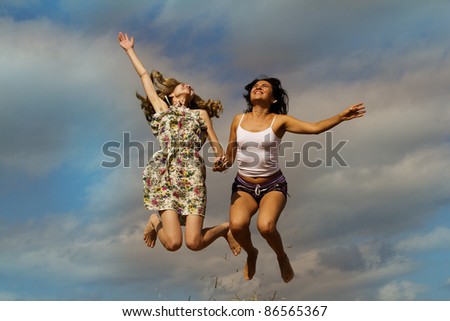 Female happy jump sky