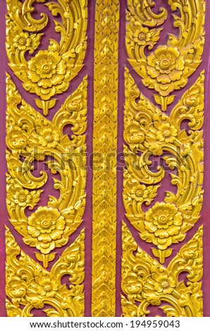 Thai buddha art with gold color on temple gate