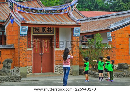 Hsinchu Taiwan October 22, 2014 a group of kindergarten children AT Lin family in front of the old house photographed