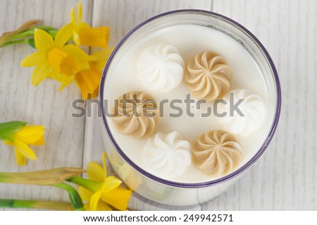 candle dessert on the table with flowers