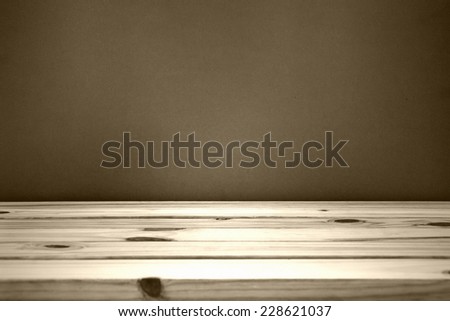 wooden table over wall grunge background, black and white