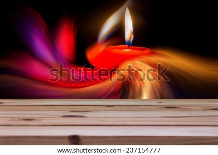 wooden table over abstract candle, fine art concept
