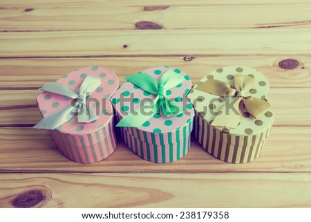 Still life with gift box on wooden table, Valentine concept