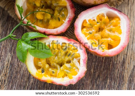 Passion fruit on wooden background, rustic style
