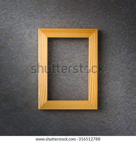 Wooden vintage photo frame over gray grunge background, Still life style