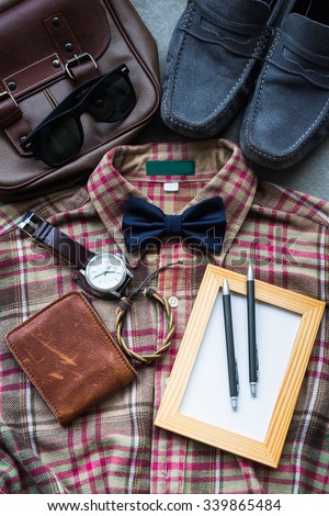 Men\'s casual outfits background, brown plaid shirt, bow tie, blue shoes, brown bag and accessories