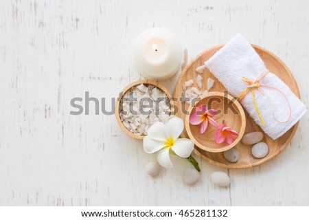 Beauty and fashion concept with spa set on white rustic wooden background