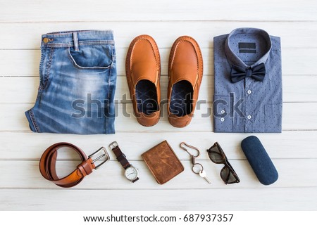 Flat lay, Men's fashion casual outfits and accessories with space on white wooden background