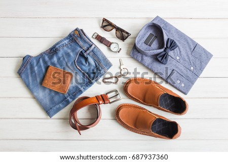 Flat lay, Men's fashion casual outfits and accessories with space on white wooden background