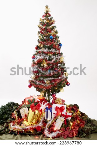 decorated christmas tree on white background with gifts