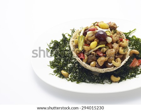 Thai food,stir  chicken with cashew nuts a famous thai dish. White plate, white background.