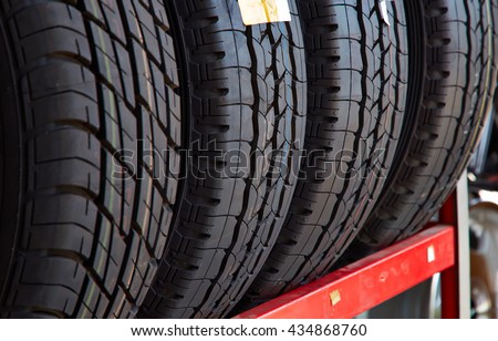 Car tires at warehouse in tire store, New four tires, Horizontal photography