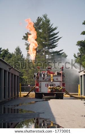 A fire truck on hand during a controlled burn on 900 gallons of propane.