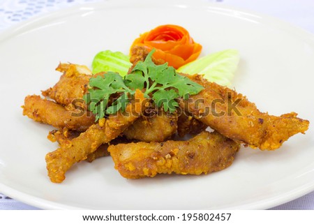 fried sliced neck pork with garlic and pepper