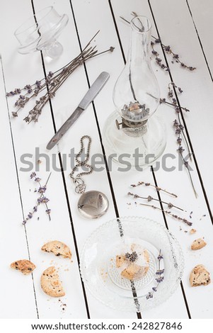 Small Cookie Gift on a Crystal Plate with Dried Lavender, a Vintage Oil Lamp and a Pocket Watch