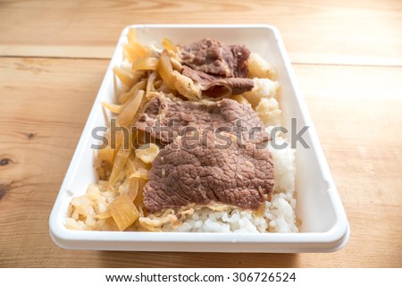 A box of lunch set, Japanese food,Gyudon benton simmered beef and onion on rice in packed lunch