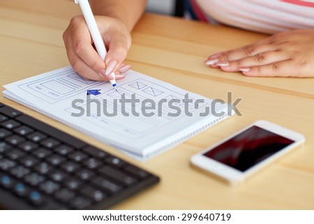 Woman sketching on paper web design