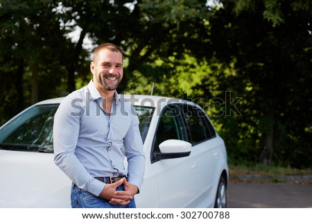 Handsome man on the background of car