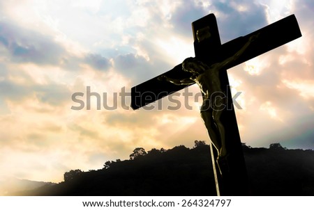 crucifixion of Jesus Christ with dramatic sky in background