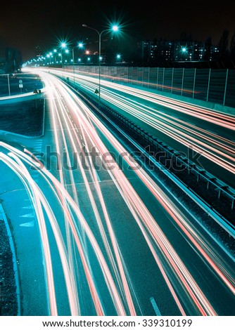 Speed Traffic - long time exposure on highway with car light trails at night