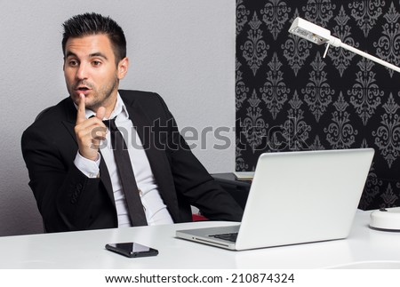 Businessman working in the office talking to someone