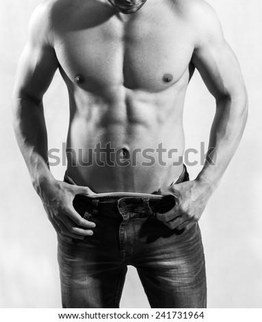 Fitness young man posing shirtless black and white