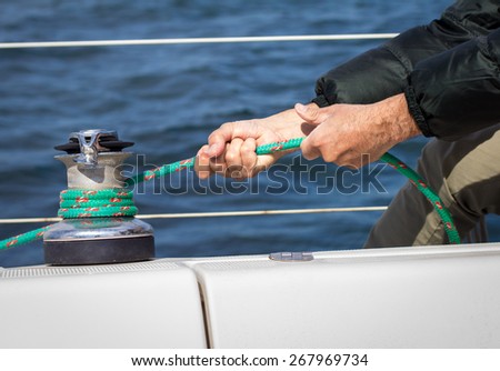 Man holding a rope in a boat