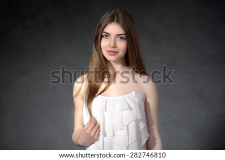 Concept human emotions. Woman shows polite against a dark background