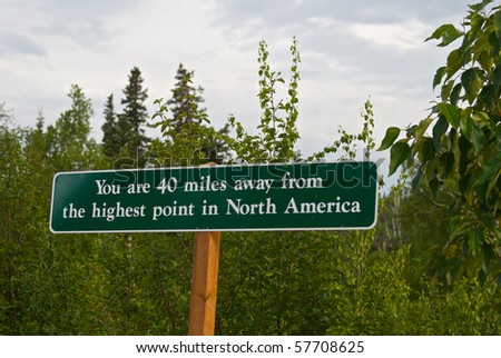Sign marks distance to Mount McKinley (also called Mount Denali) from a lodge in Alaska.  Good travel image.