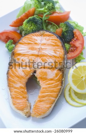 fresh salmon cooked with tomato salad broccoli salad