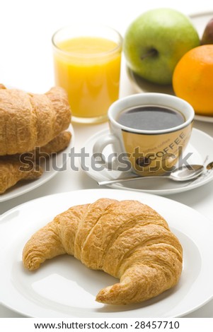 delicious continental breakfast of coffee and croissants isolated