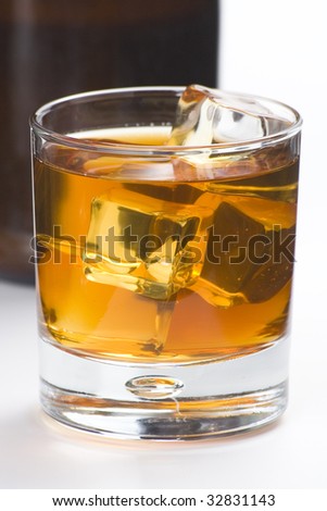 alcoholic beverage whith ice cubes isolated over white