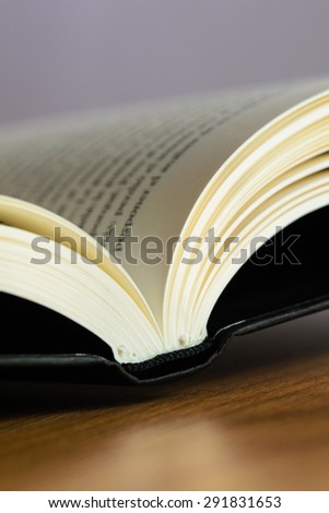 Black book on wooden table