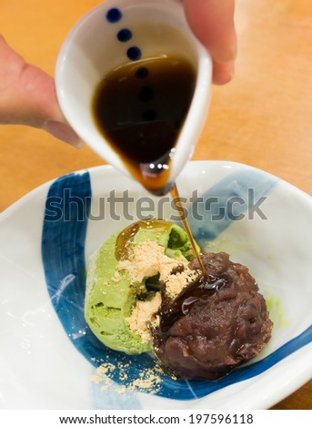 japanese green tea ice cream with red bean paste, topping with syrup