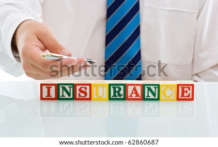 Businessman handing a pen to sign the insurance