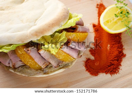 Duck Breast Kebab Sandwich on wooden board
