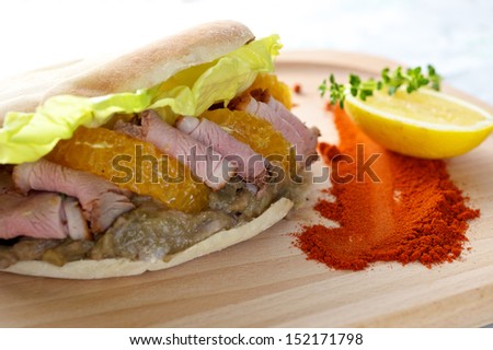 Duck Breast Kebab Sandwich on wooden board