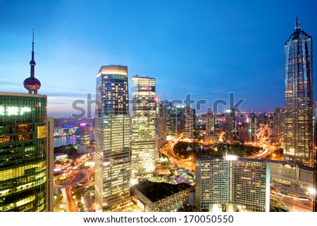 Shanghai, China, August 15, 2013: A view at Pudong Skyline in Shanghai, thriving city in China. Beautiful sunset night view