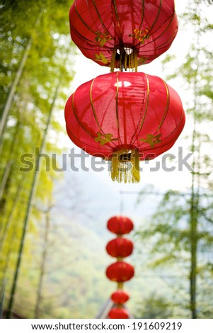 red Chinese lantern on a green bamboo background
