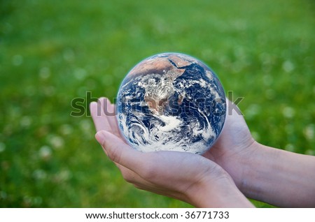 Hand holding a globe. Save Earth Environment