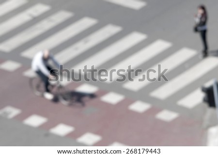 people crossing the street on the zebra crossing