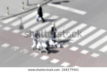 people crossing the street on the zebra crossing