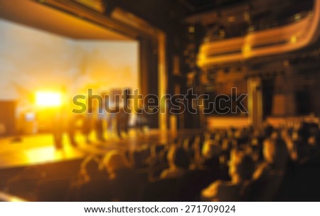Audience in a theater, on a concert  and applauding