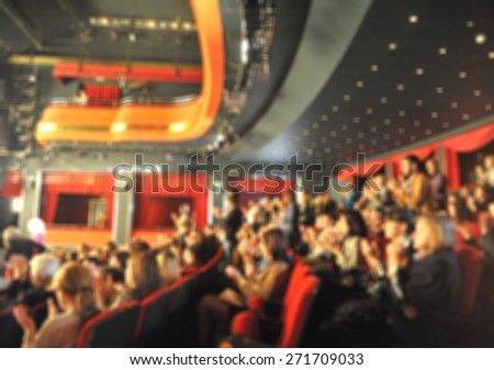 Audience in a theater, on a concert  and applauding