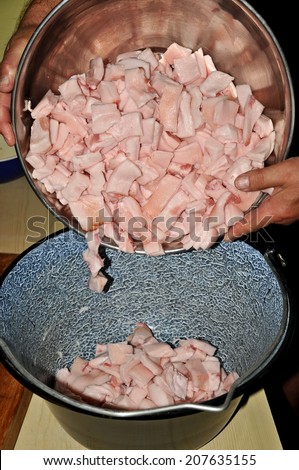 Bowl with the pork fat pieces for the greaves