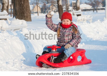 winter games in the snow/children with Christmas presents