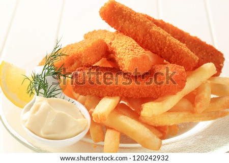 Fried fish sticks with French fries and mayonnaise
